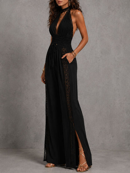 Romina | Tuta nera halter con pannelli in pizzo e vita arricciata